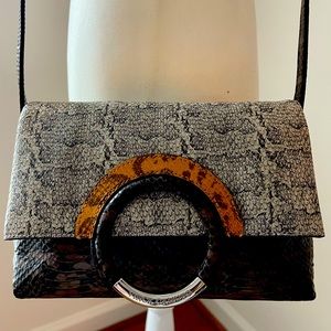 Vince Camuto leather crossbody. NWOT, never used. Snap closure, multiple pockets